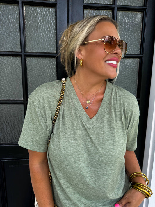 Sage green Loose-fitting boyfriend tee with deep V-neck and soft jersey slub fabric—perfect for layering or casual wear