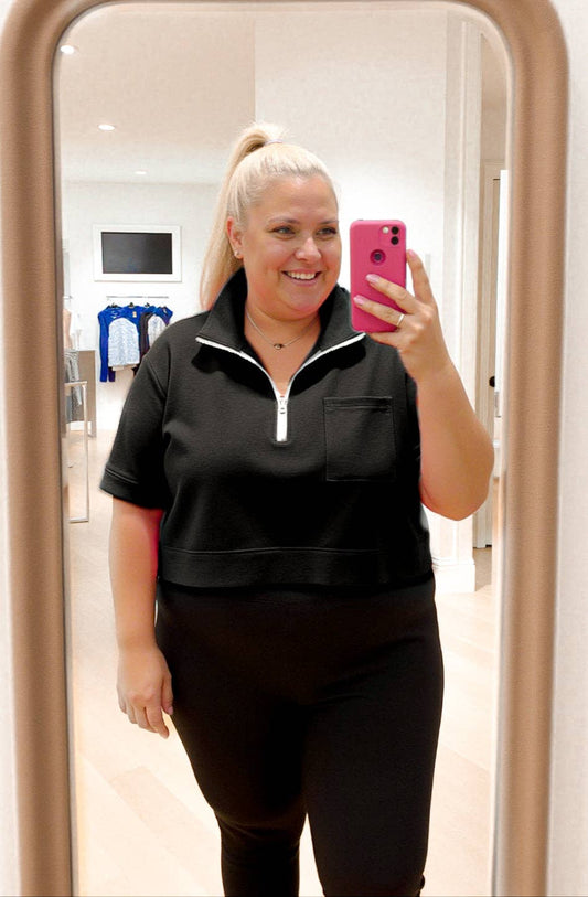 Black athleisure top with collar and white zipper