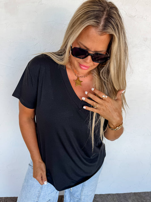 Black Loose-fitting boyfriend tee with deep V-neck and soft jersey slub fabric—perfect for layering or casual wear