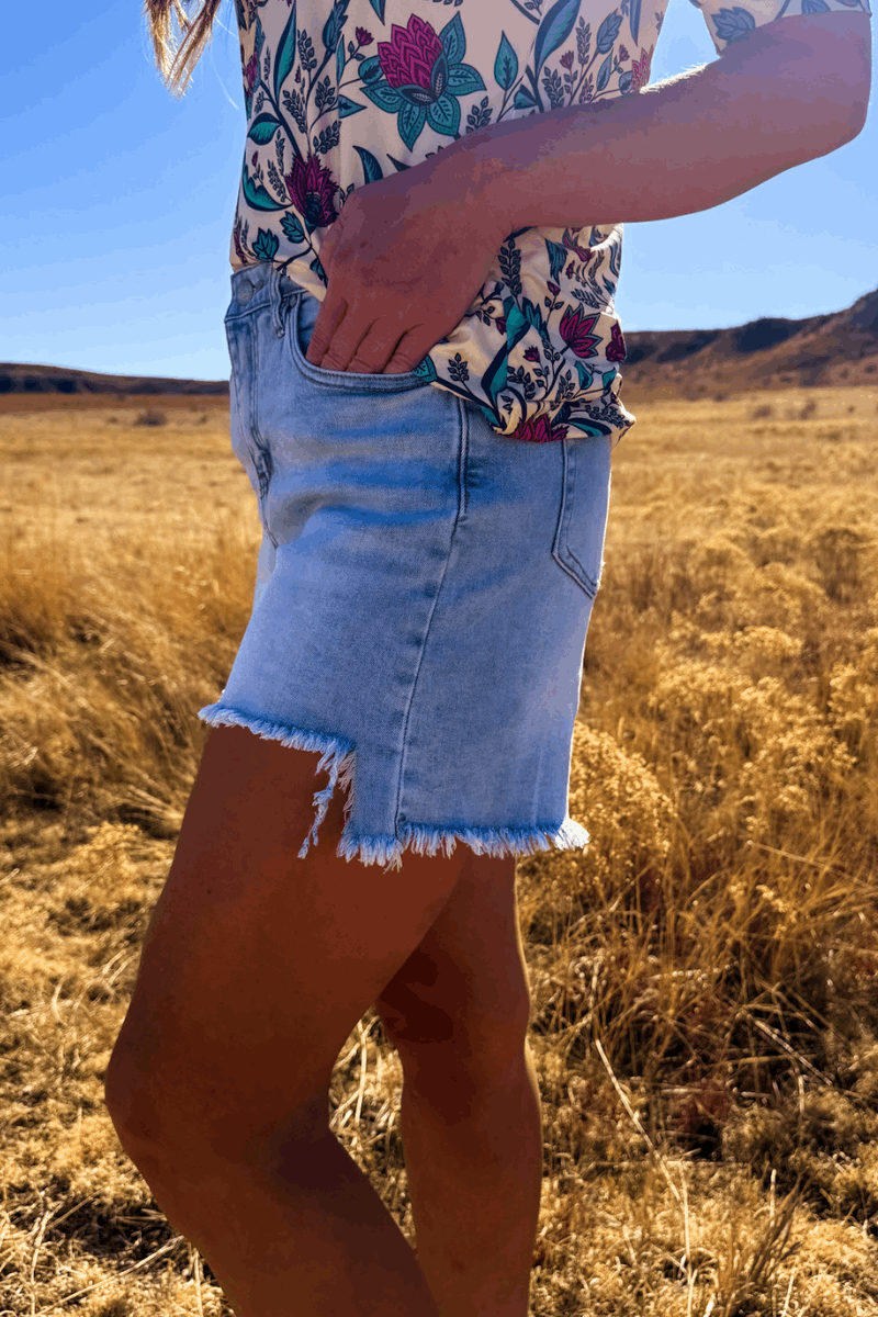 Light Wash Denim Shorts with Asymmetrical Hem
