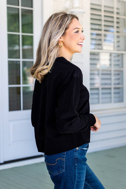 Black Cropped lightweight sweatshirt with long sleeves—perfect for layering with high-rise jeans or leggings during cooler fall days, side view