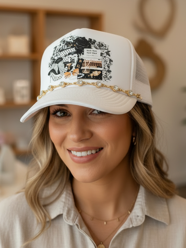Woman wearing a white cap with decorative elements in an indoor setting