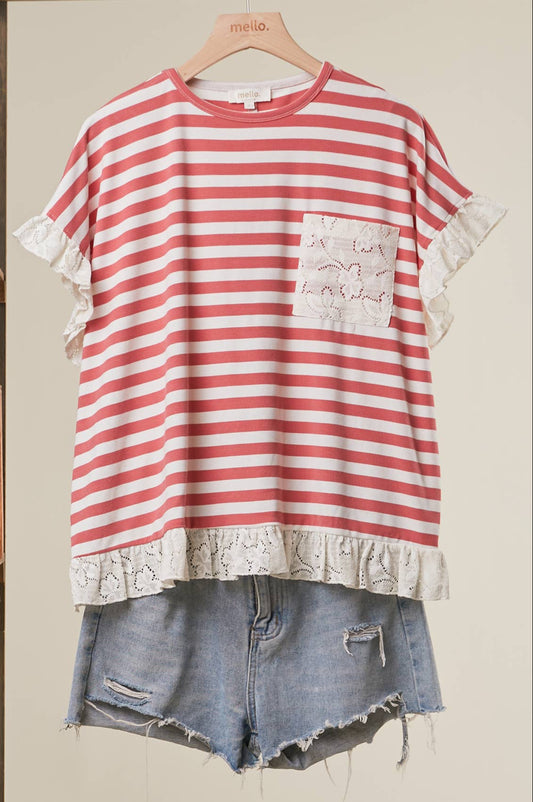 Red and white striped shirt with lace trim and denim shorts on a hanger against a neutral background.