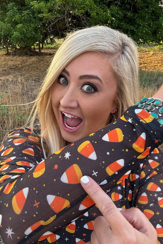 Black halloween fall mesh top with candy corn pattern 