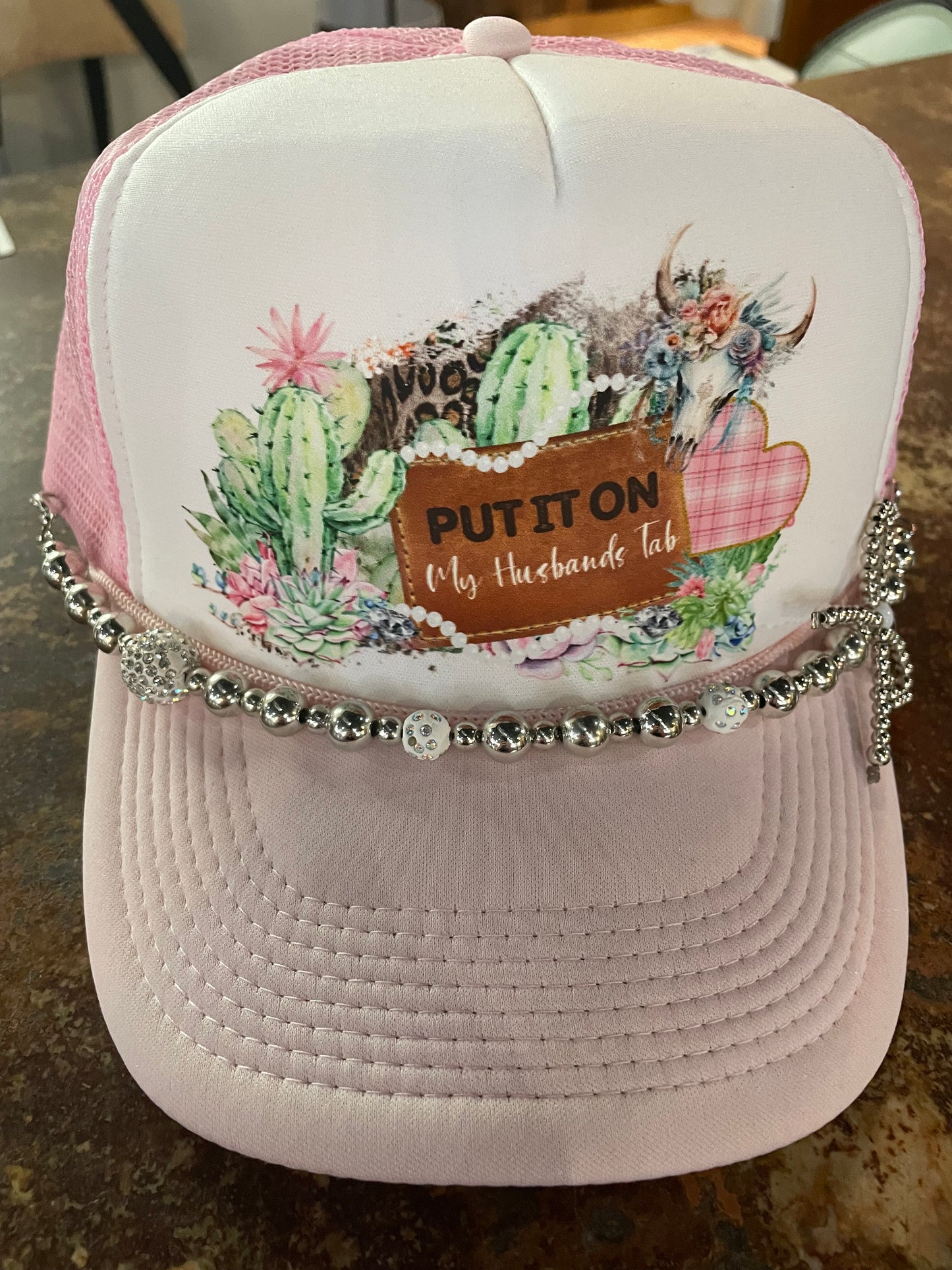 Put It On My Husbands Tab Trucker Hat