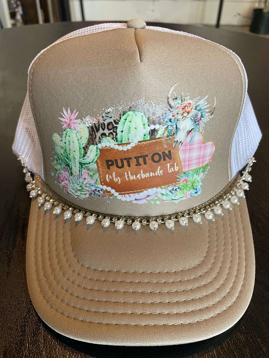 Put It On My Husbands Tab Trucker Hat