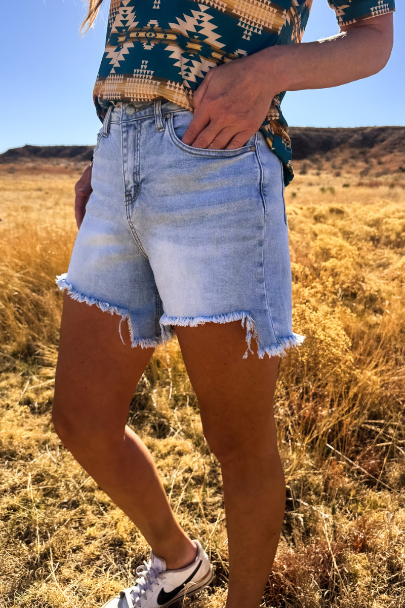 Light Wash Denim Shorts with Asymmetrical Hem