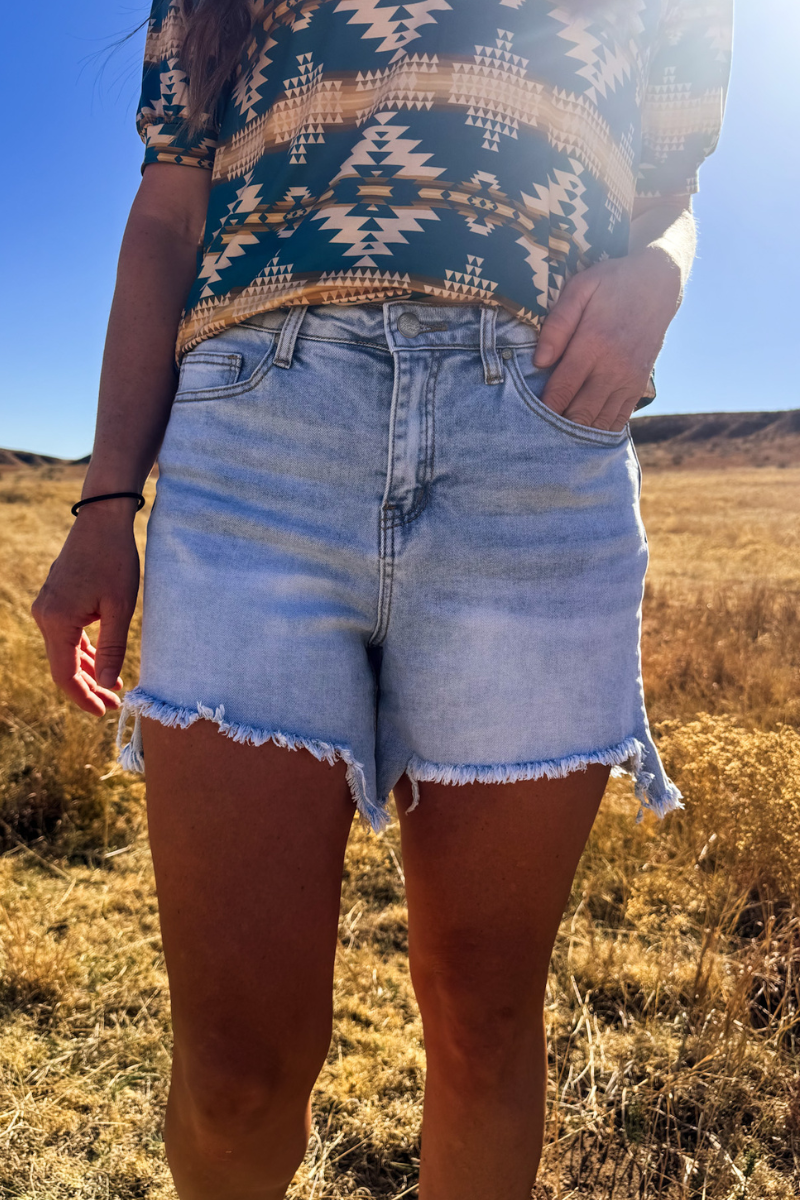 Light Wash Denim Shorts with Asymmetrical Hem