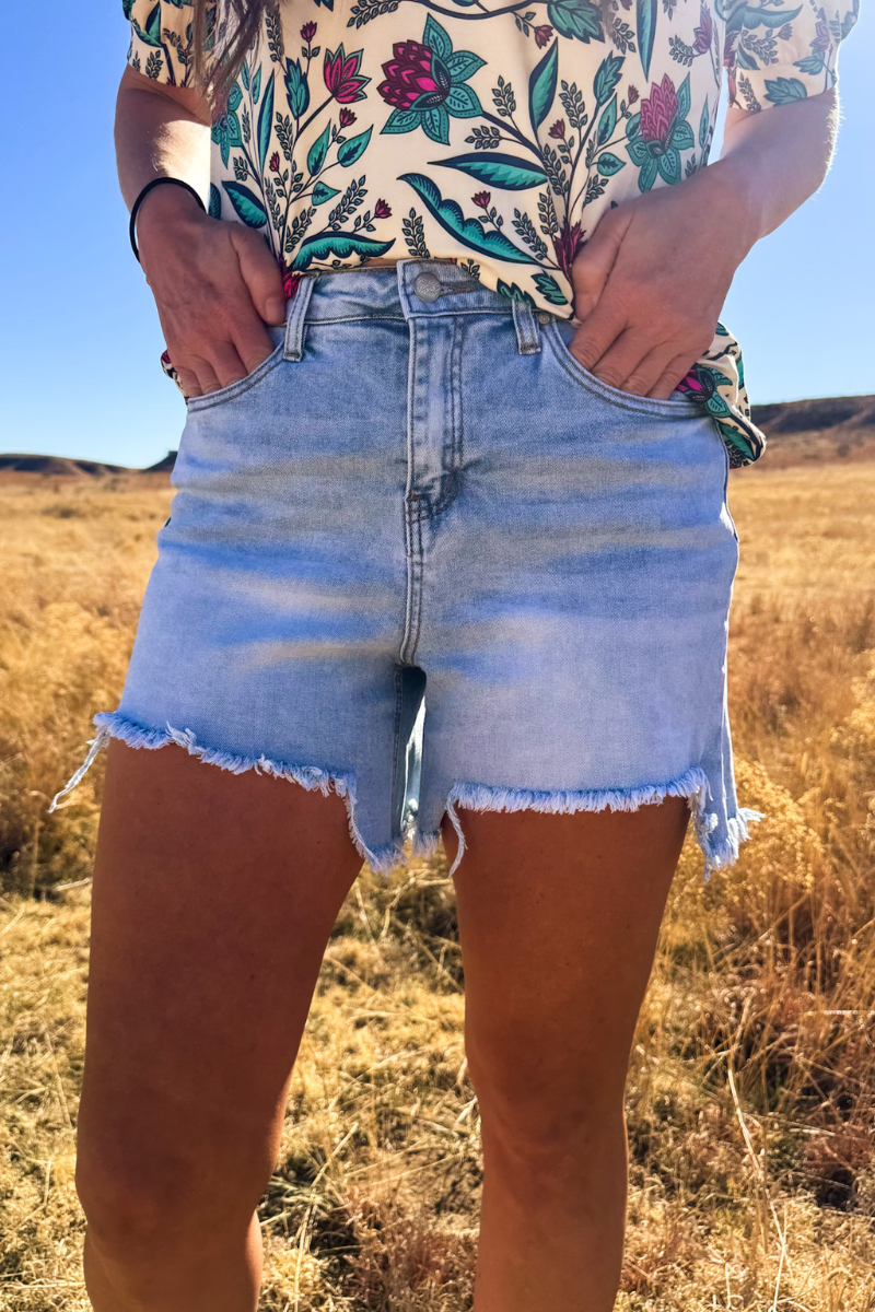 Light Wash Denim Shorts with Asymmetrical Hem
