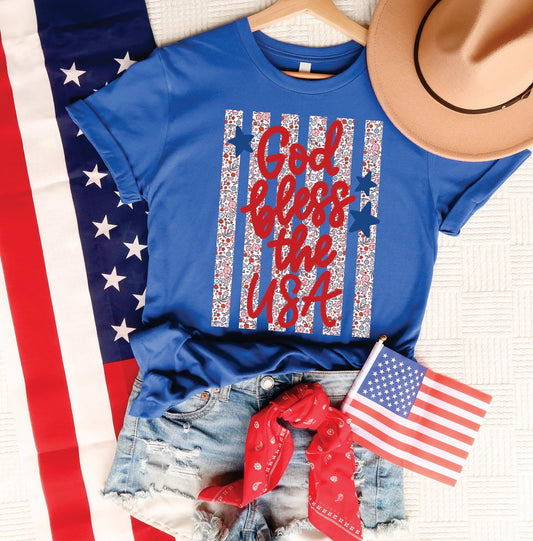 Blue t-shirt with 'God bless the USA' text on an American flag background
