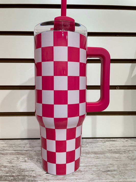 Pink and white checkered tumbler with insulated design for keeping drinks cool in style