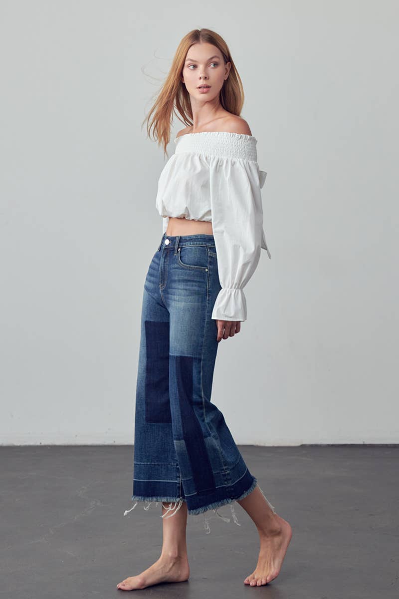 Mid Rise Raw Hem Crop Flare Jeans