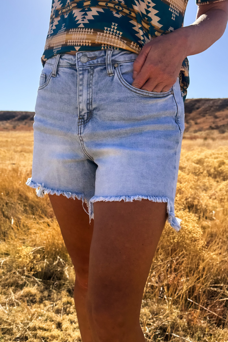 Light Wash Denim Shorts with Asymmetrical Hem